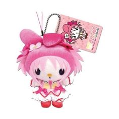 a pink hello kitty keychain hanging from a hook on a white background with a tag attached to it