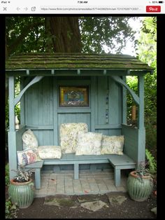 an image of a garden bench made out of old doors and shutters, with the caption're - escape com attach a little sitting cabana to the front of your shed '