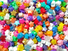 many different colored beads are scattered together