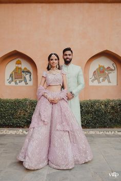 a man and woman standing next to each other