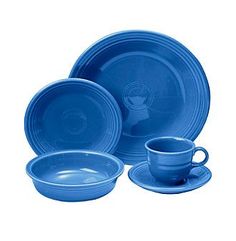 a set of blue dishes with cups and saucers