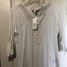 Beautiful White Top Nwt. Dainty Lace And Crochet Accents With Two Functional Buttons. Buttons On Both Sleeves To Roll Up. Casual White Stretch Blouse, Stretch Cotton Blouse For Vacation, White Stretch Top With 3/4 Sleeve, White 3/4 Sleeve Summer Tops, White 3/4 Sleeve Tops For Vacation, White Stretch Cotton Blouse, Fitted Beach Top With 3/4 Sleeves, Fitted Top With 3/4 Sleeve For Beach, Fitted 3/4 Sleeve Top For Beach