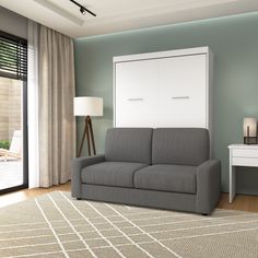 a living room with a gray couch and white cabinet next to a sliding glass door