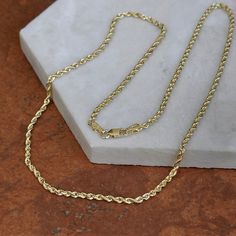 10KT yellow gold diamond cut rope 18" in length chain necklace 10KT Yellow Gold Weighs 6.04 Grams 2.25mm in Width Solid chain Stamped 10K 14k Gold Rope Chain Necklace With Curb Chain, 14k Gold Oval Link Rope Chain Necklace, 14k Yellow Gold Curb Chain Rope Necklace, 14k Gold Curb Chain Rope Necklace Gift, Yellow Gold Rope Chain Necklace, 14k Gold Figaro Rope Chain Necklace As Gift, Yellow Gold Figaro Chain Rope Necklace Gift, Rope Chain Necklace, White Gold Bracelet