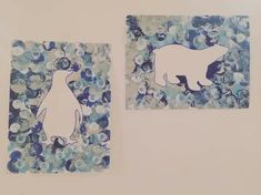 two pieces of paper with blue and white designs on them, one has a penguin and the other is a polar bear