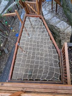 an overhead view of a wooden structure with netting