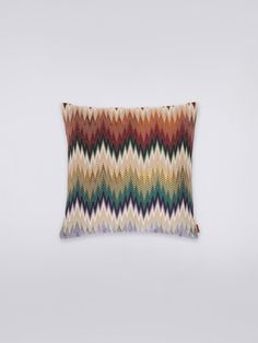 a multicolored pillow on a white background