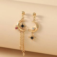 This Lovely Boho Pair Of Mismatched Celestial Crescent Moon And Eight Point Star Dangle Earrings Is A Wonderful Addition To Your Wardrobe And Your Style! This Unique Pair Is Sure To Get Lots Of Compliments! Dangling Star Earrings, Moon And Sun Earrings, Eight Point Star, Moon Earrings Studs, Star Dangle Earrings, Reality Shifting, Boho Drop Earrings, Flower Resin Jewelry, Earthy Style