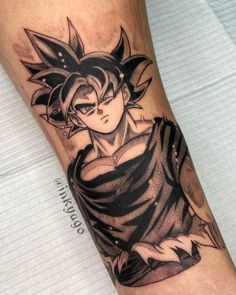 a man's leg with a tattoo on it that has an image of gohan