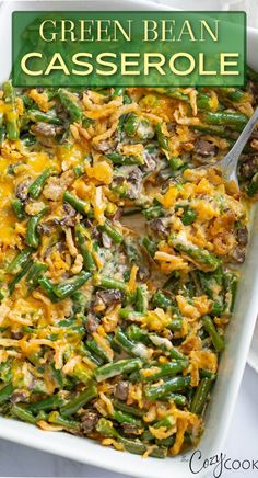 green bean casserole in a white dish with a serving spoon on the side