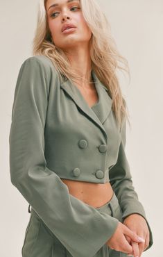 Our Cool Classic Crop Blazer will have everyone asking where your top is from. It has a double breasted button closure and a layered open back. Pair with the matching Cool Classic Pants for a complete look. Layered Back With Tie Detailing 95% POLYESTER 5% SPANDEX LE1501 Classic Trousers, Crop Blazer, Classic Pants, Classic Blazer, Cropped Blazer, Knit Sweatshirt, Effortless Chic, Mens Activewear, Our Girl