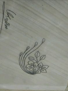 a close up of a skateboard with flowers on it's side and writing in black ink