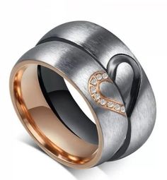 two tone gold and silver heart ring with diamonds in the center, on white background