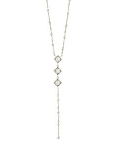 Introducing the Reine Lariat Necklace, a luxurious piece crafted for the sophisticated individual. This elegant necklace features a delicate beaded chain adorned with lustrous pearls, exuding an air of exclusivity and refinement. Elevate any outfit with the timeless style and grace of the Reine Lariat Necklace. Material: 14K gold or rhodium plated brass, freshwater pearls Features: Measures 16" with 2" extender, 3.75" drop, 0.35" pendants, 5mm pearls, 2mm chain, Lead & Nickel free, lobster clasp Elegant Silver Chain Necklace With Pearl Drop, Elegant Lariat Necklace For Formal Occasions, Elegant Adjustable Chain Backdrop Necklace, Elegant Adjustable Backdrop Necklace, Elegant Pearl Charm Dangle Lariat Necklace, Elegant Pearl Charm Lariat Necklace With Dangle, Elegant Lariat Necklace With Pearl Charm Dangle, Elegant Adjustable Beaded Chain Necklace, Elegant Pendant Lariat Necklace For Formal Occasions