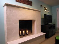 a living room with a fire place and television