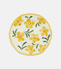 a yellow and white plate with flowers painted on it