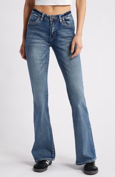 A '70s groove defines these stretch-kissed jeans that feature flared legs and embroidered stars at the back pockets 35 1/2" inseam; 22" leg opening; 9" front rise;15" back rise (size 29) Zip fly with button closure Five-pocket style 69% cotton, 26% polyester, 3% viscose, 2% elastane Machine wash, line dry Imported Embroidered Stars, Flare Leg Jeans, Fabric Gift Bags, Nordstrom Store, Fabric Gifts, Free Fabric, Signature Design, Leg Jeans, Nordstrom