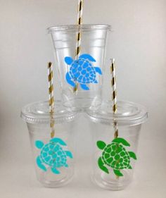 four cups with straws and turtle designs on them