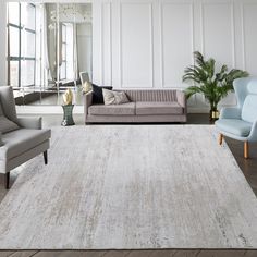 a living room filled with furniture and a rug