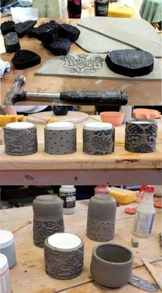 some pottery is sitting on a wooden table