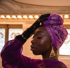 A vibrant purple fabric with metallic gold and black silhouette triangles. Shape your style with this head wrap as the statement for a gaudy ensemble. Approximate Length: 17" X 72" Indigenous Men, African American Women Hairstyles, Fashion Reference, Beauty Supplies, People Photos, Vibrant Purple, Black Silhouette, Purple Fabric, African American Women