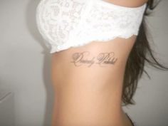 a woman with a tattoo on her stomach that says, don't be afraid