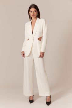 Diamond cutouts are a girl's best friend. The Cassian Cut Out Blazer is uniquely constructed to interweave structured tailoring with dramatic diamond cutouts on the sides of the bodice that sweep around into a partially-opened back. The effect is an unexpected and unforgettable silhouette. Imagined in striking ivory for a sharp aesthetic. Pair with the matching pant for engagement parties and weddings.FIT: fitted with slim sleeves. - Cutout detailing - Single breasted - Jet pockets with flap at Sharp Aesthetic, Bridal Pants, Cocktail Suit, Satin Suit, Curvy Bride, Engagement Parties, Party Pants, Tailored Pants, Jacket Sale