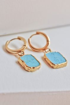 Elegant turquoise earrings with a huggie hoop closure. Delicate and dainty earrings for all occasion. These gold huggie hoops with turquoise set makes it the perfect gift for bridesmaids, friends, sisters, and mothers. We hope you will love your piece.  #GiftForMom  #GoldEarrings  #HoopsEarrings   #Earrings Elegant Turquoise Huggie Earrings Gift, Turquoise Hoop Earrings With Natural Stones, Turquoise Hoop Gemstone Jewelry, Turquoise Gemstone Hoop Jewelry, Blue Tarnish Resistant Huggie Jewelry, Blue Tarnish-resistant Huggie Jewelry, Turquoise Hoop Earrings With Natural Stones As Gift, Gold Plated Dangle Hoop Earrings With Gemstones, Turquoise Natural Stone Hoop Earrings As Gift