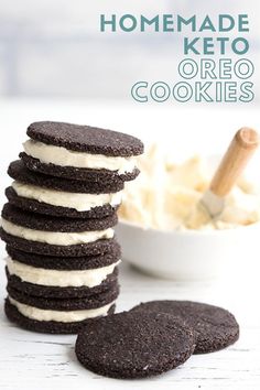 homemade keto oreo cookies stacked on top of each other in front of a bowl of ice cream