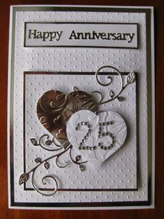 an anniversary card with two hearts on it