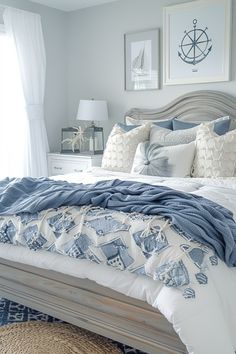 a bed with blue and white comforter in a bedroom