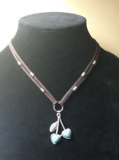 Blue howlite Cherries on a double brown choker necklace with double strands of brown suede, silver beads.  Approximately 16" and a 3" extension Cheap Handmade Brown Choker, Brown Choker, Blue Howlite, Mount Airy, Brown Suede, Silver Beads, Pendant Necklaces, Jewelry Necklace Pendant, Choker