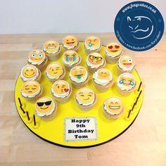 cupcakes are arranged on a yellow plate with the words happy birthday to you