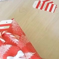 an open red present box on a wooden table