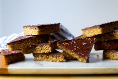 several pieces of cake sitting on top of a cutting board with sprinkles