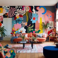 a living room filled with lots of colorful furniture and paintings on the wall behind it