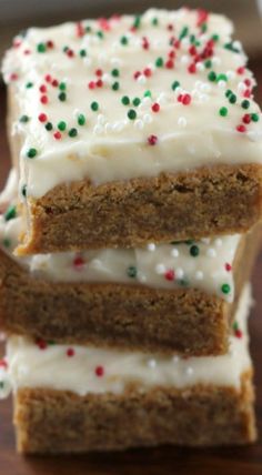 three slices of cake with white frosting and sprinkles