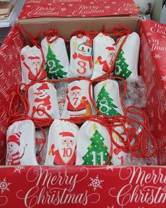 a box filled with christmas cookies on top of a table