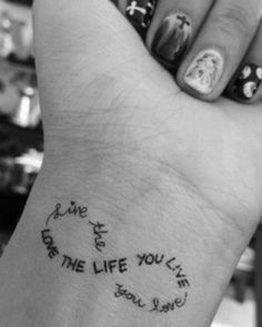 a woman's hand with a tattoo on it that says, you are the life you