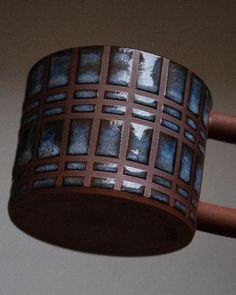 a close up of a light fixture with metal squares on it