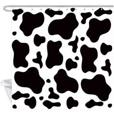 a black and white cow print shower curtain