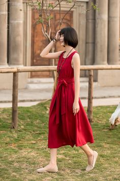 "This red linen dress has a special design. It has different styles. You look even more mod and fashionable in this dress with belt. While, without the belt, it gives a loose and relax looking. It will be your wise choice. Your wardrobe needs it. DETAIL * Made of linen, Eco friendly option , luscious fabric, the material is strong yet still flows. * Pleated A line dress * red high loose waist * crew neck line * Two side pockets * Tie belted dress * Sleeveless dress * Midi length * Perfect for su Red Sleeveless Sundress For Summer, Red Sleeveless Dress For Summer Day Out, Casual Red Linen Beach Dress, Casual Red Sleeveless Dress For Day Out, Linen Dresses For Picnic, Red Linen Bohemian Dress, Red Linen Summer Beach Dress, Chic Linen Dress For Picnic, Red Bohemian Linen Dress