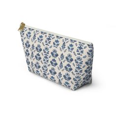 a blue and white floral print zipper bag