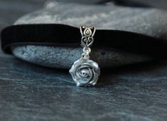 "Velvet choker pendant - Short necklace flower - Polymer clay jewelry Velvet ribbon choker with sparkly silver rose. Material of rose - polymer clay with the special cover. Each petal of flower made by hand Dia flower about 15 mm/ 0.55 \" Length of necklace is adjustable: 10-12 inches/ 25,4 - 30,5 cm 11-13 inches/ 28-33 cm 12-14 inches/ 30.5- 35.5 cm 13-15 inches/ 33-38 cm 14-16 inches/ 35.5 cm-40.5 cm 15-17 inches/ 38,1 cm- 43,2 cm 16-18 inches/ 40.6 cm- 45.7 cm 17-19 inches/ 43 cm - 48 cm 18-2 Flower Charm Choker As A Gift, Adjustable Flower Pendant Choker Gift, Adjustable Flower Pendant Choker For Gift, Flower Shaped Choker With Flower Charm As Gift, Floral Choker With Flower Charm As A Gift, Gift Flower Pendant Adjustable Choker, Adjustable Rose Design Choker Necklace, Rose Design Choker Jewelry Gift, Gift Rose Design Choker In Rose Color