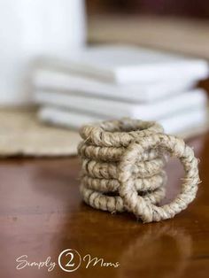 there is a stack of rope on the table next to some napkins and a coffee mug