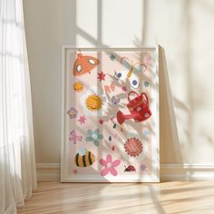 a white frame sitting on top of a hard wood floor next to a window filled with sunlight