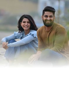 a man and woman sitting next to each other in front of a white background with the caption's name on it