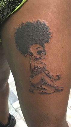 a woman's leg with a tattoo on it that looks like she is sitting down