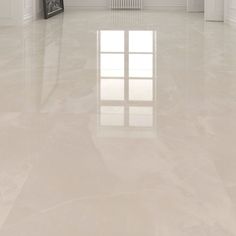 an empty room with white walls and floors