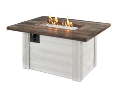 an outdoor fire pit with flames burning on it's sides and wood table top